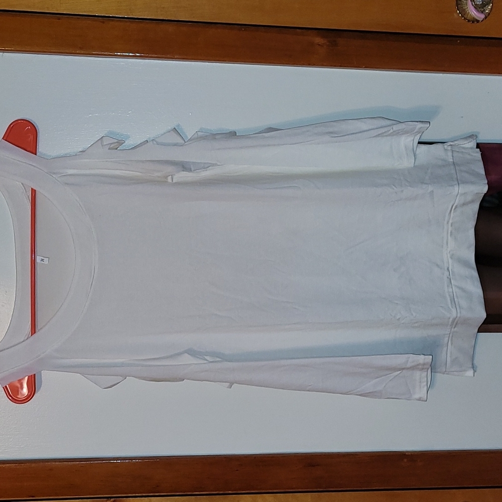 Long sleeved white shirt with slits down both sleeves. Size M